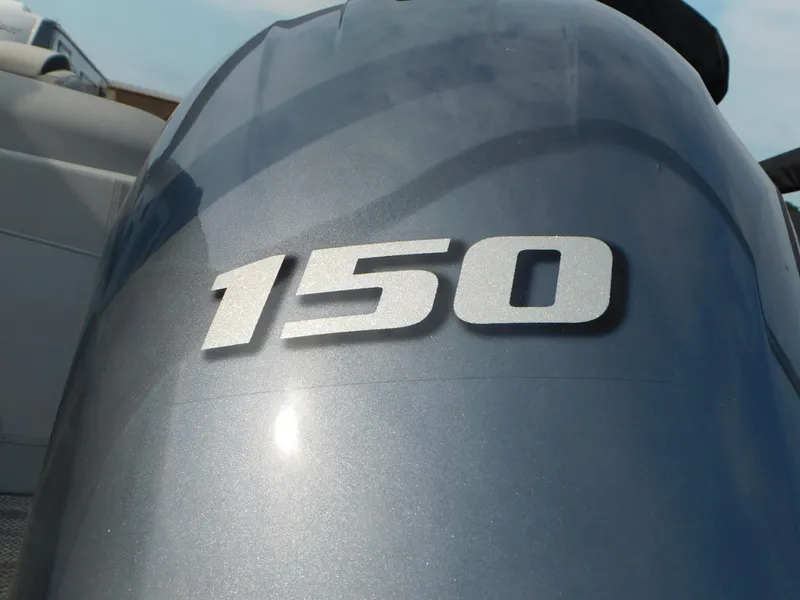 Slide: The Image of Close-up of a 150 horsepower engine on a 2023 Bennington 23LFB boat. - 11