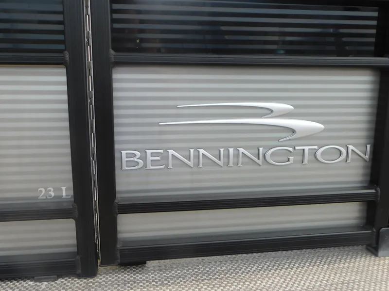 Slide: The Image of 2023 Bennington 23LFB boat logo on metallic panel. - 2