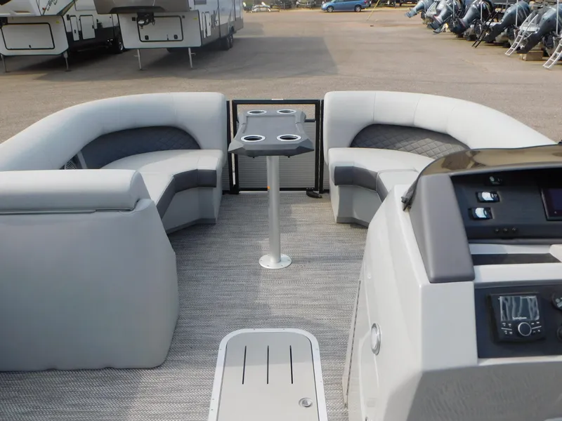 Slide: The Image of 2023 Bennington 23LFB pontoon boat interior with seating and table. - 8