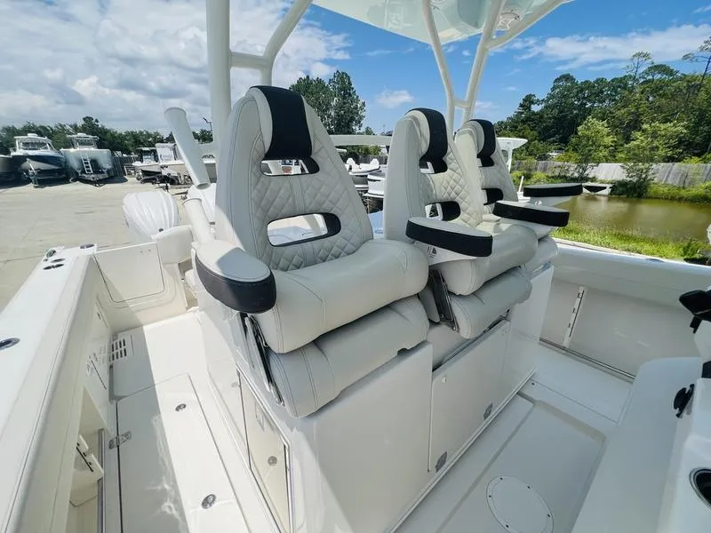 Slide: The Image of 2024 Sailfish 360 CC boat with luxurious seating and modern design. - 14