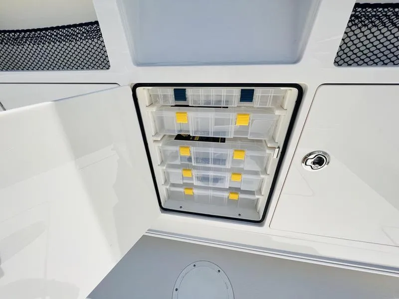 Slide: The Image of Built-in storage compartment on the 2024 Sailfish 360 CC boat. - 19