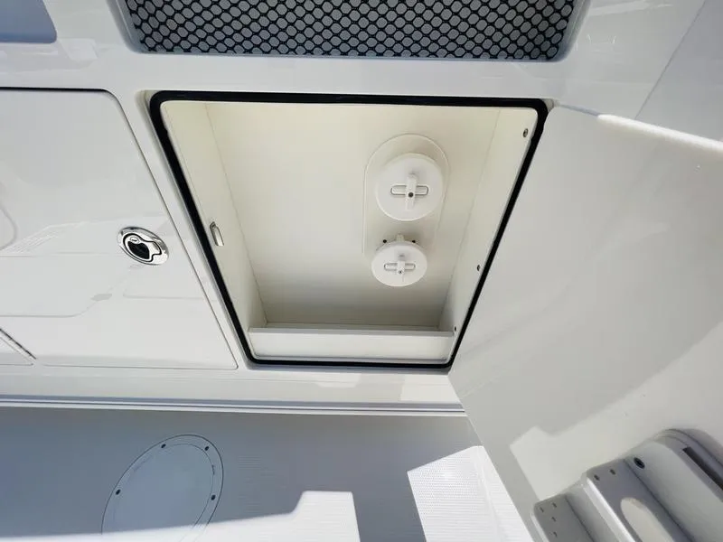 Slide: The Image of Open storage compartment on 2024 Sailfish 360 CC boat. - 20