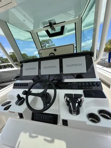 Slide: The Image of 2024 Sailfish 360 CC helm with Garmin navigation displays. - 31