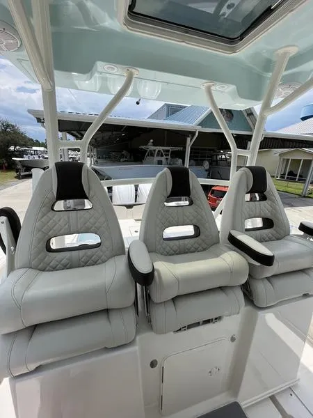 Slide: The Image of 2024 Sailfish 360 CC boat with luxurious seating and modern design. - 39