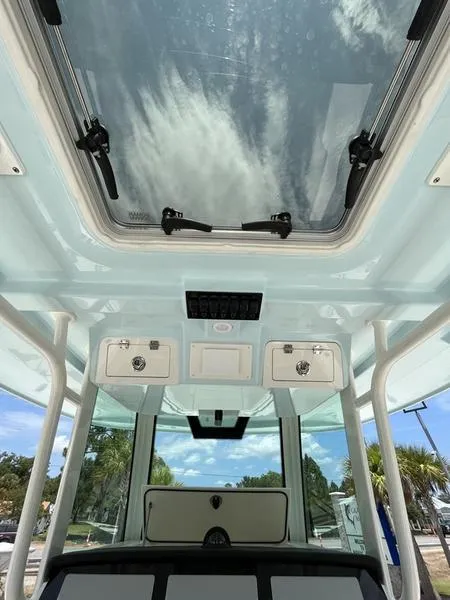 Slide: The Image of 2024 Sailfish 360 CC boat interior with skylight and storage compartments. - 40