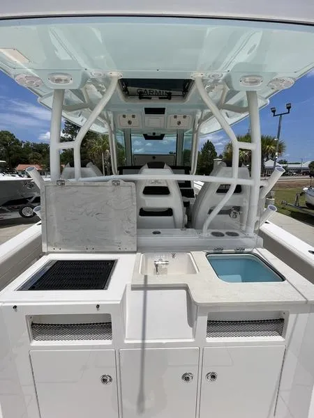 Slide: The Image of 2024 Sailfish 360 CC center console boat interior with seating and storage. - 42