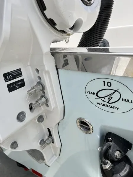 Slide: The Image of Close-up of 2024 Sailfish 360 CC boat with 10-year hull warranty sticker. - 49
