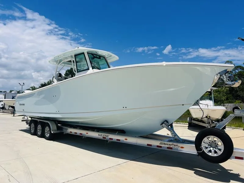 Slide: The Image of 2024 Sailfish 360 CC boat on trailer under blue sky. - 5
