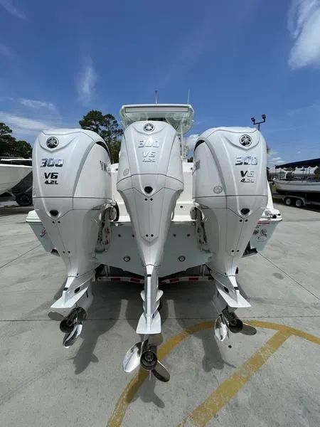 Slide: The Image of 2024 Sailfish 360 CC boat with triple Yamaha 300 V6 outboard engines. - 50