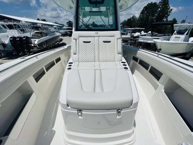 Slide: The Image of 2024 Sailfish 360 CC boat interior with white seating and console. - 7