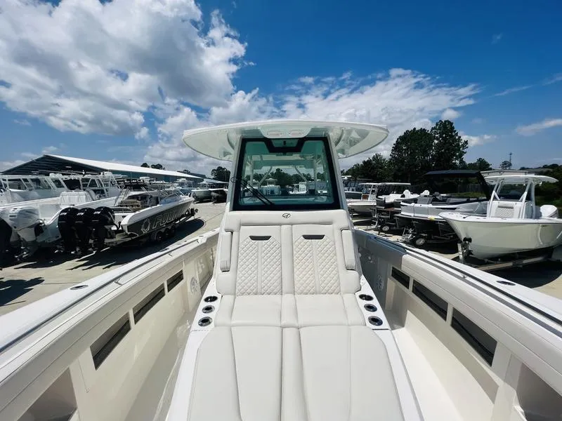 Slide: The Image of 2024 Sailfish 360 CC center console boat with luxurious seating and modern design. - 8