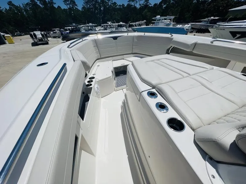 Slide: The Image of 2024 Sailfish 360 CC boat with spacious seating and cup holders. - 9