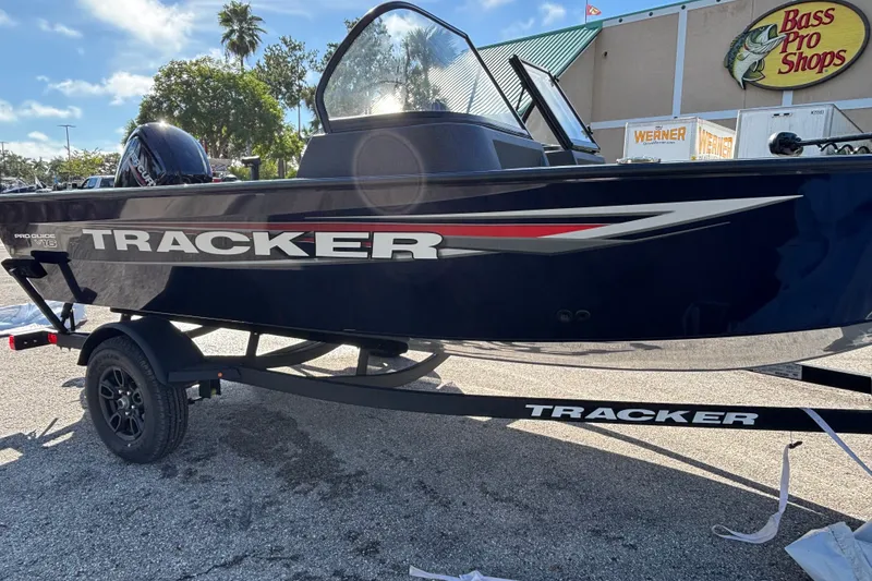 The Image of 2023 Tracker Pro Guide V-175 WT boat on trailer at Bass Pro Shops parking lot. - 0