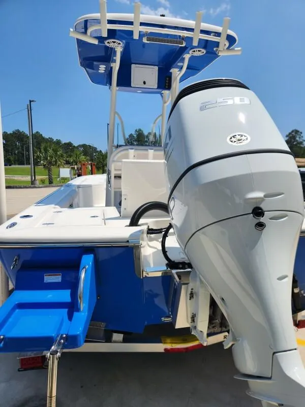 Slide: The Image of 2023 Sea Born FX22 Bay boat with powerful outboard motor. - 2