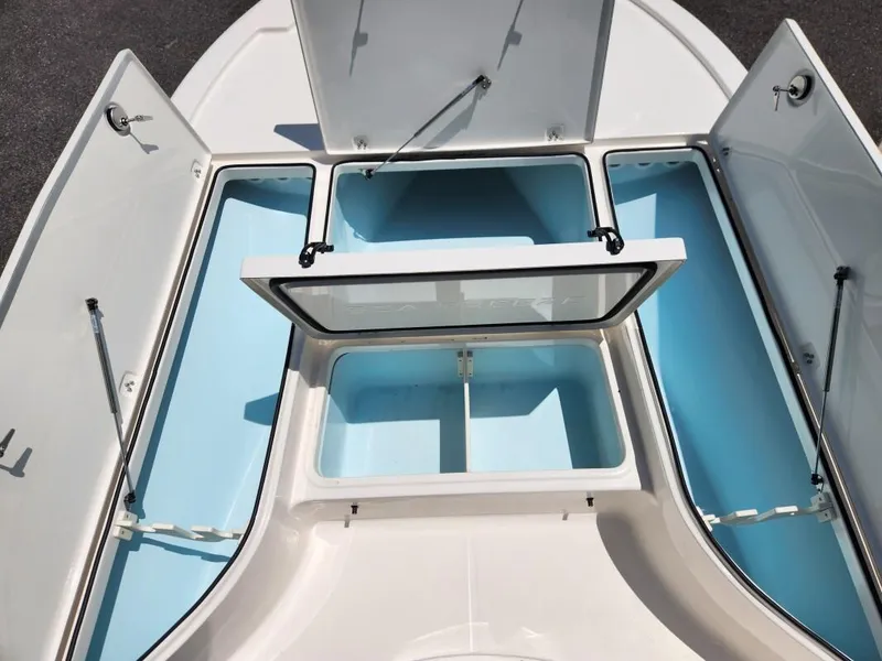Slide: The Image of 2023 Sea Born FX22 Bay boat storage compartments open. - 3