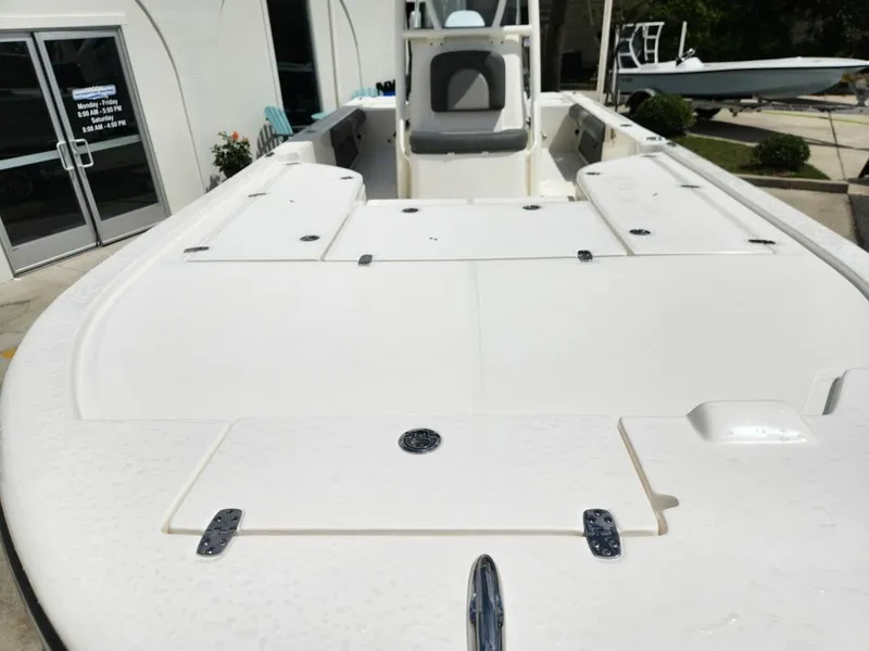 Slide: The Image of 2023 Sea Born FX24 Bay boat deck and seating area. - 2