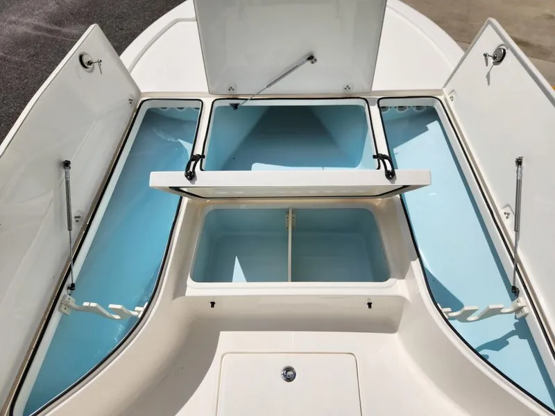 Slide: The Image of 2023 Sea Born FX24 Bay boat storage compartments open. - 3