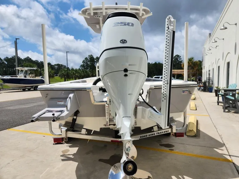 Slide: The Image of 2023 Sea Born FX24 Bay boat on a Road King trailer, rear view. - 5