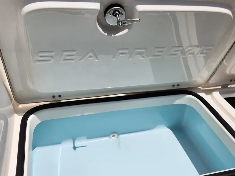 Slide: The Image of 2023 Sea Born FX24 Bay boat with open Sea Freeze storage compartment. - 8