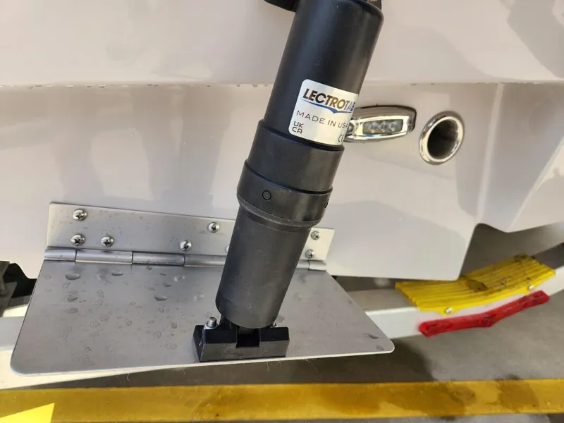 Slide: The Image of Close-up of trim tab on 2023 Sea Born FX24 Bay boat. - 9