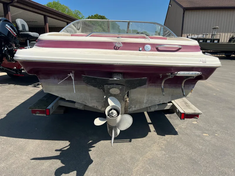 Slide: The Image of 1996 Maxum 1900 SR2 boat rear view with propeller, parked on a trailer. - 10