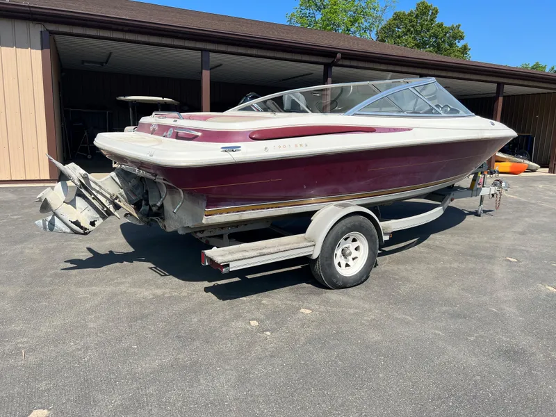 Slide: The Image of 1996 Maxum 1900 SR2 boat on a trailer in a driveway. - 4