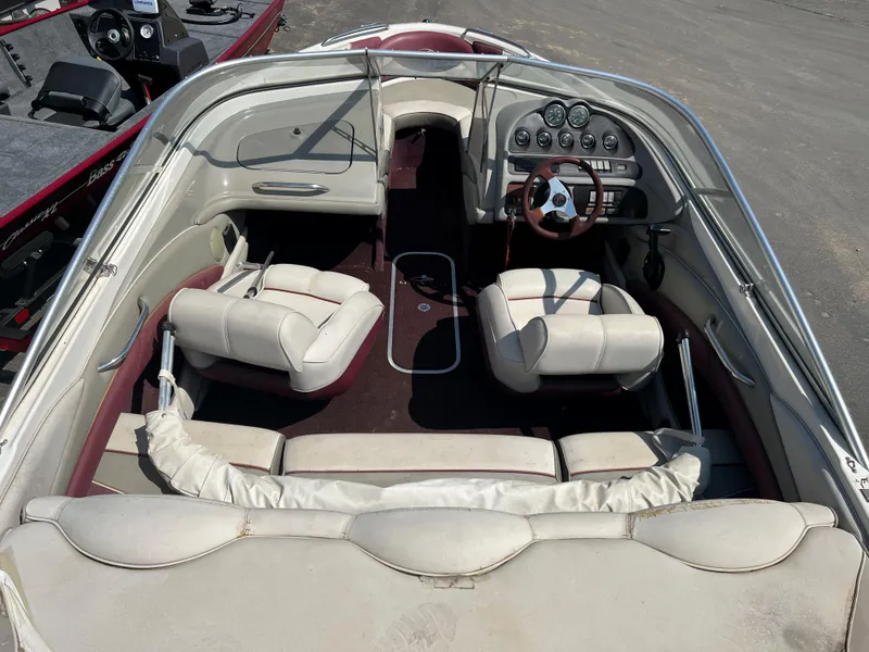 Slide: The Image of 1996 Maxum 1900 SR2 boat interior with white seats and dashboard. - 5
