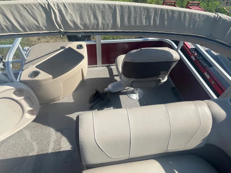 Slide: The Image of 2018 Sun Tracker Fishin' Barge 20 DLX interior with seating and console. - 11