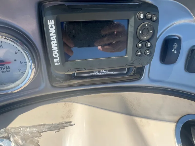 Slide: The Image of Close-up of 2018 Sun Tracker Fishin' Barge 20 DLX dashboard with Lowrance fish finder. - 13