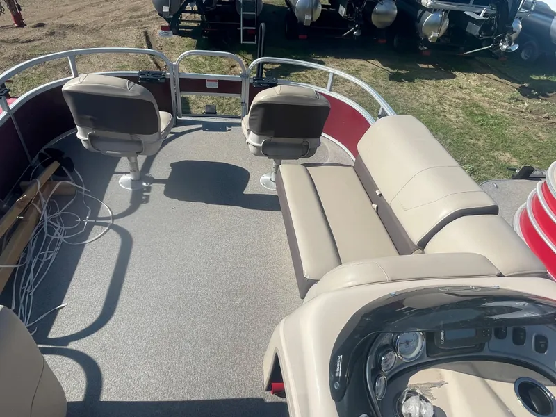 Slide: The Image of 2018 Sun Tracker Fishin' Barge 20 DLX interior with seating and control panel. - 15