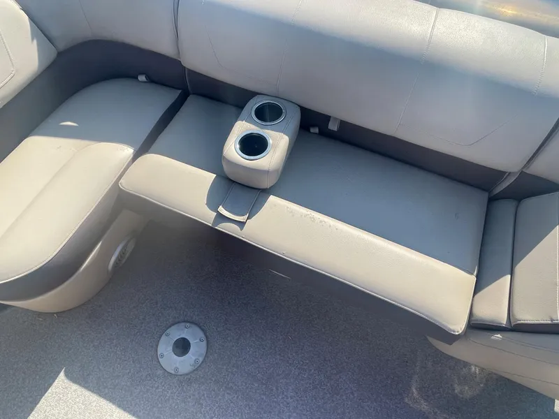 Slide: The Image of 2018 Sun Tracker Fishin' Barge 20 DLX interior seating with cup holders. - 16