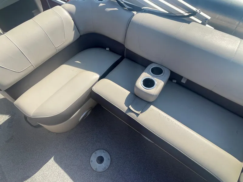 Slide: The Image of 2018 Sun Tracker Fishin' Barge 20 DLX interior seating with cup holders. - 17