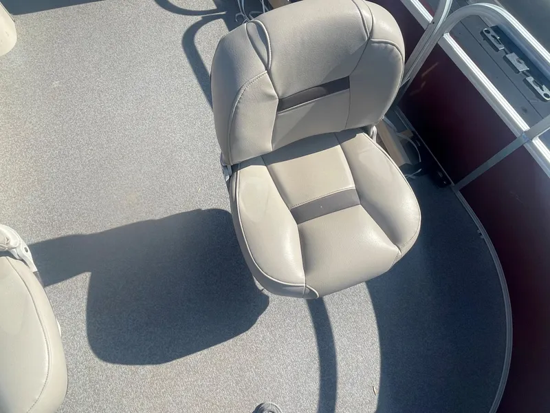 Slide: The Image of 2018 Sun Tracker Fishin' Barge 20 DLX boat seat, gray upholstery, and deck view. - 7