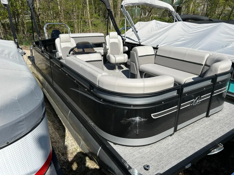 The Image of 2023 Qwest Splash Pad RW LTZ pontoon boat with spacious seating and sleek design. - 0