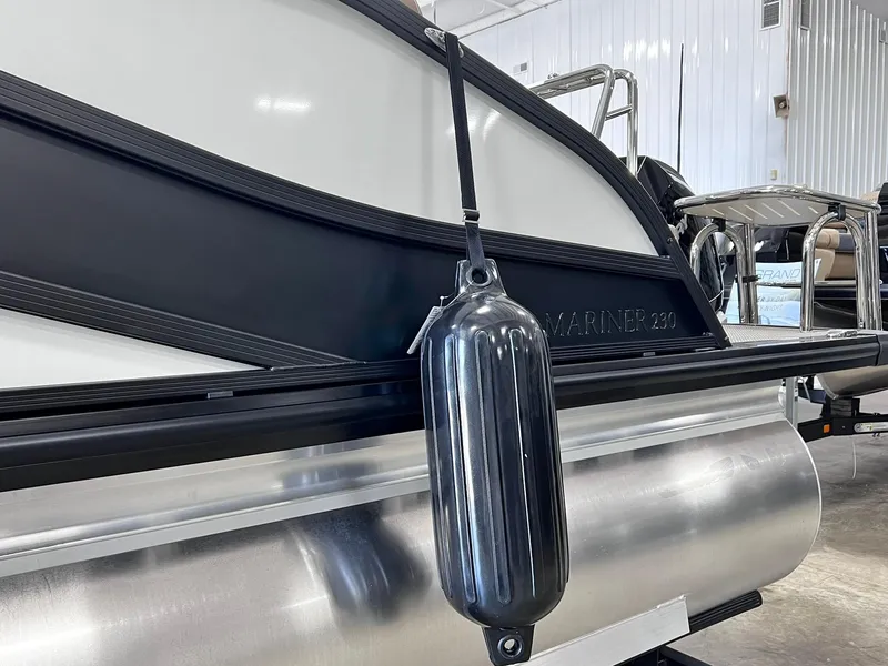 Slide: The Image of 2024 Harris Grand Mariner 230 pontoon boat in a showroom. - 10