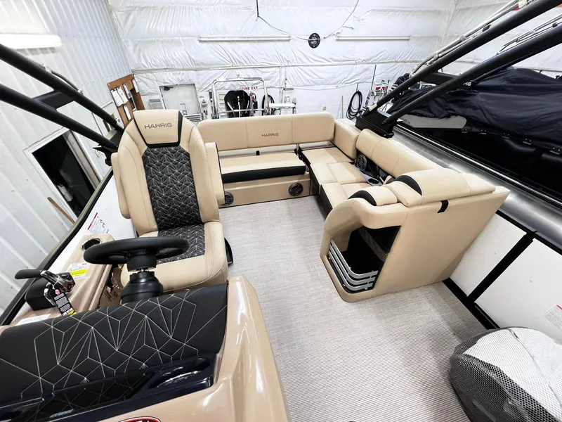 Slide: The Image of 2024 Harris Grand Mariner 230 boat interior with beige seating and modern design. - 15
