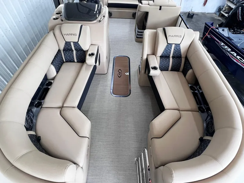 Slide: The Image of 2024 Harris Grand Mariner 230 boat interior with luxurious beige seating and modern design. - 16