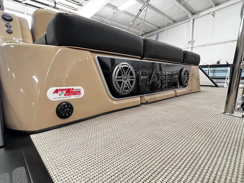 Slide: The Image of 2024 Harris Grand Mariner 230 boat interior with beige seating and carpet. - 30