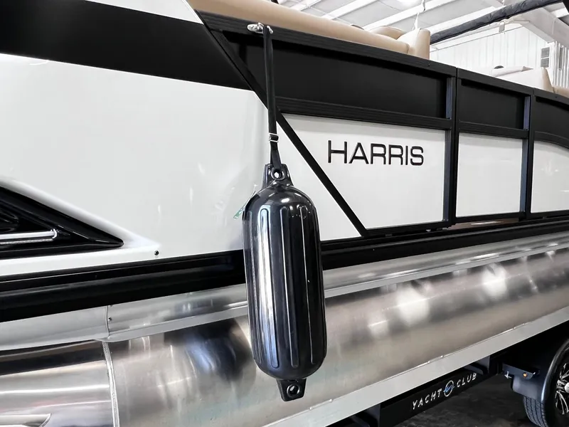 Slide: The Image of 2024 Harris Grand Mariner 230 pontoon boat side view in a showroom. - 9