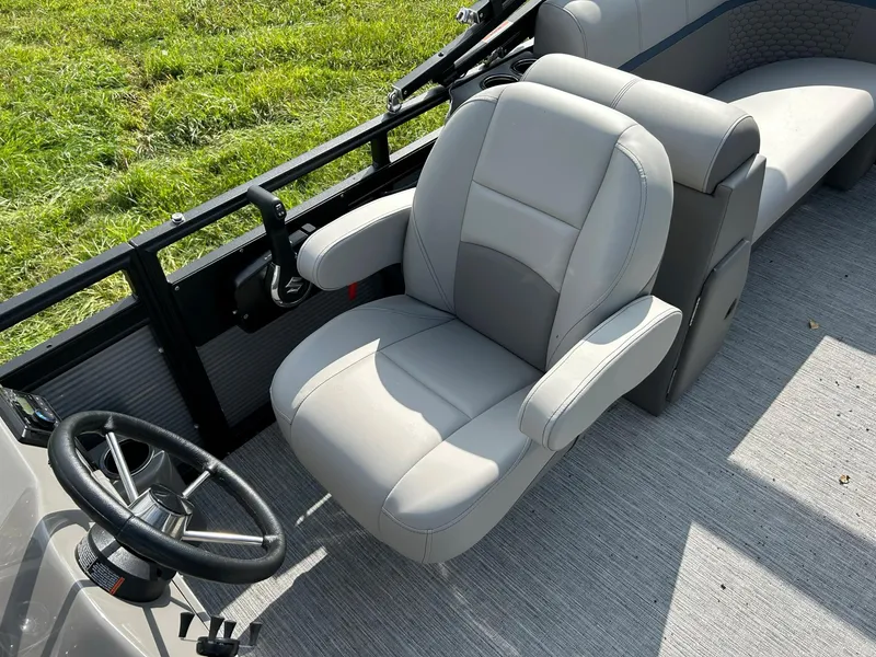 Slide: The Image of 2023 Qwest 820 RLS L boat captain's chair and steering wheel. - 10