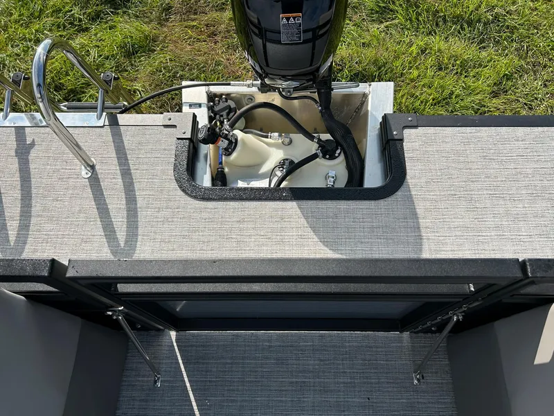 Slide: The Image of 2023 Qwest 820 RLS L boat engine compartment with motor and ladder. - 15