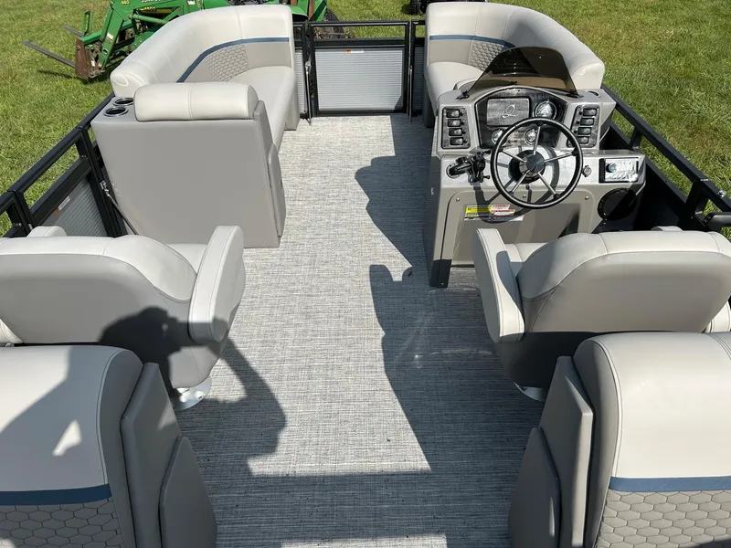Slide: The Image of 2023 Qwest 820 RLS L pontoon boat interior with steering console and seating. - 16