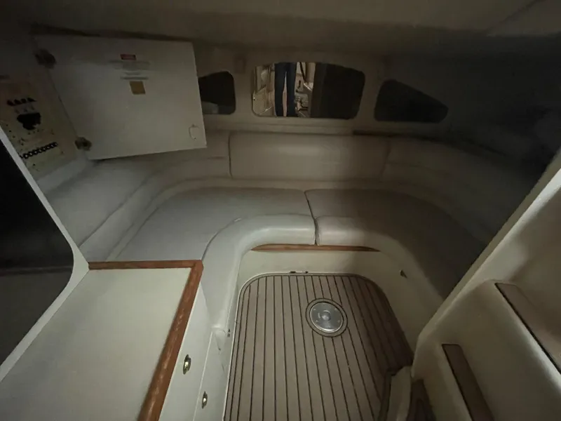 Slide: The Image of 1997 Cruisers Yachts 3375 Esprit cabin interior with seating and storage. - 14