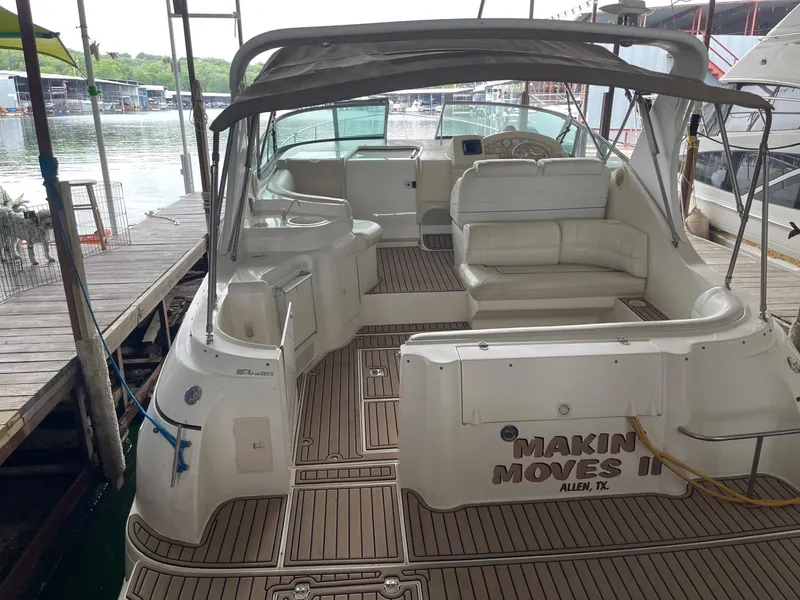 Slide: The Image of 1997 Cruisers Yachts 3375 Esprit boat interior with seating, docked at marina. - 5