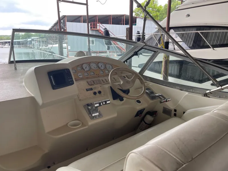 Slide: The Image of 1997 Cruisers Yachts 3375 Esprit helm with steering wheel and instrument panel. - 6