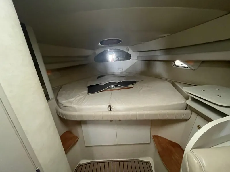 Slide: The Image of 1997 Cruisers Yachts 3375 Esprit cabin interior with bed and storage. - 9