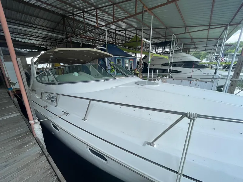 The Image of 1997 Cruisers Yachts 3375 Esprit docked in a covered marina. - 0