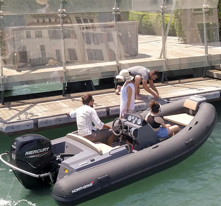 Slide: The Image of 2022 Northstar Axis 4.2 boat docked with passengers, featuring a Mercury engine. - 12