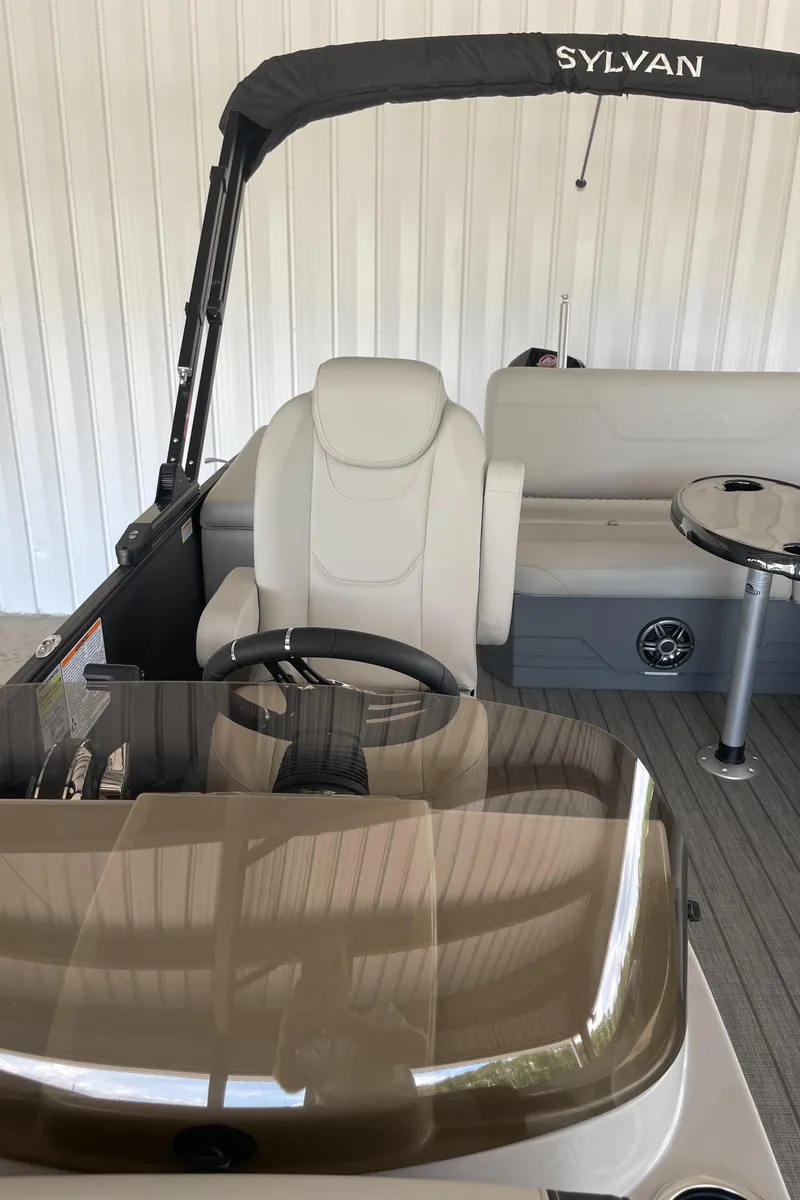 Slide: The Image of 2023 Sylvan Mirage X X5 CLZ pontoon boat interior with helm and seating. - 10