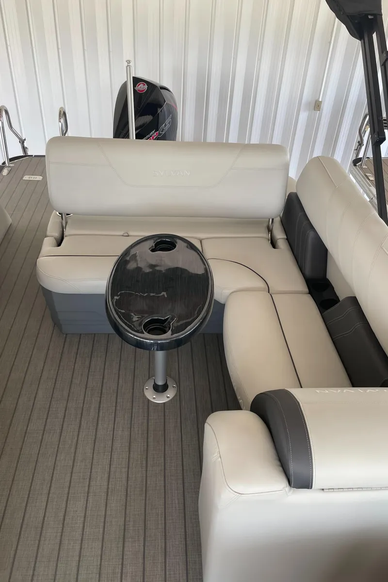 Slide: The Image of 2023 Sylvan Mirage X X5 CLZ boat interior with seating and table. - 11